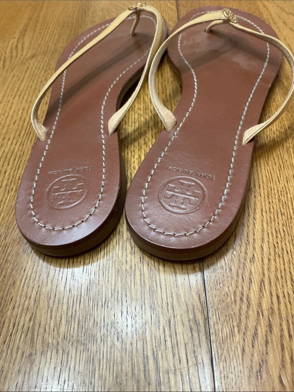 Woman’s Tory Burch tan patent leather thong sandal. Size 9.5. Leather. Like new!